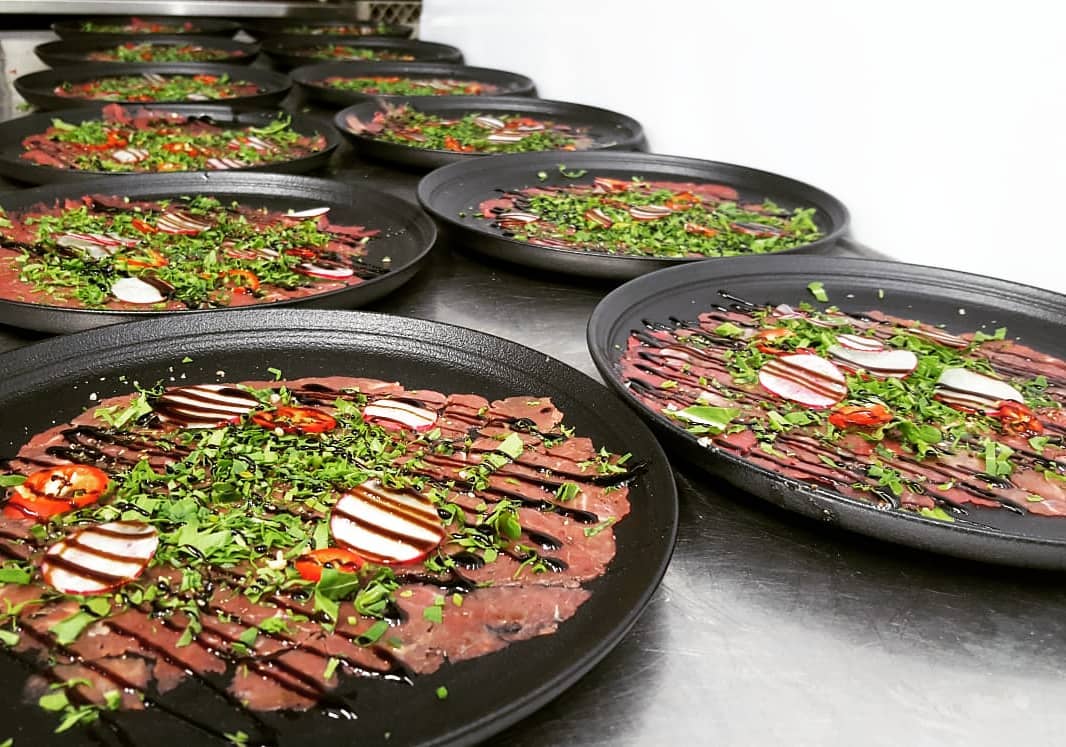 Beef carpaccio plates with balsamic