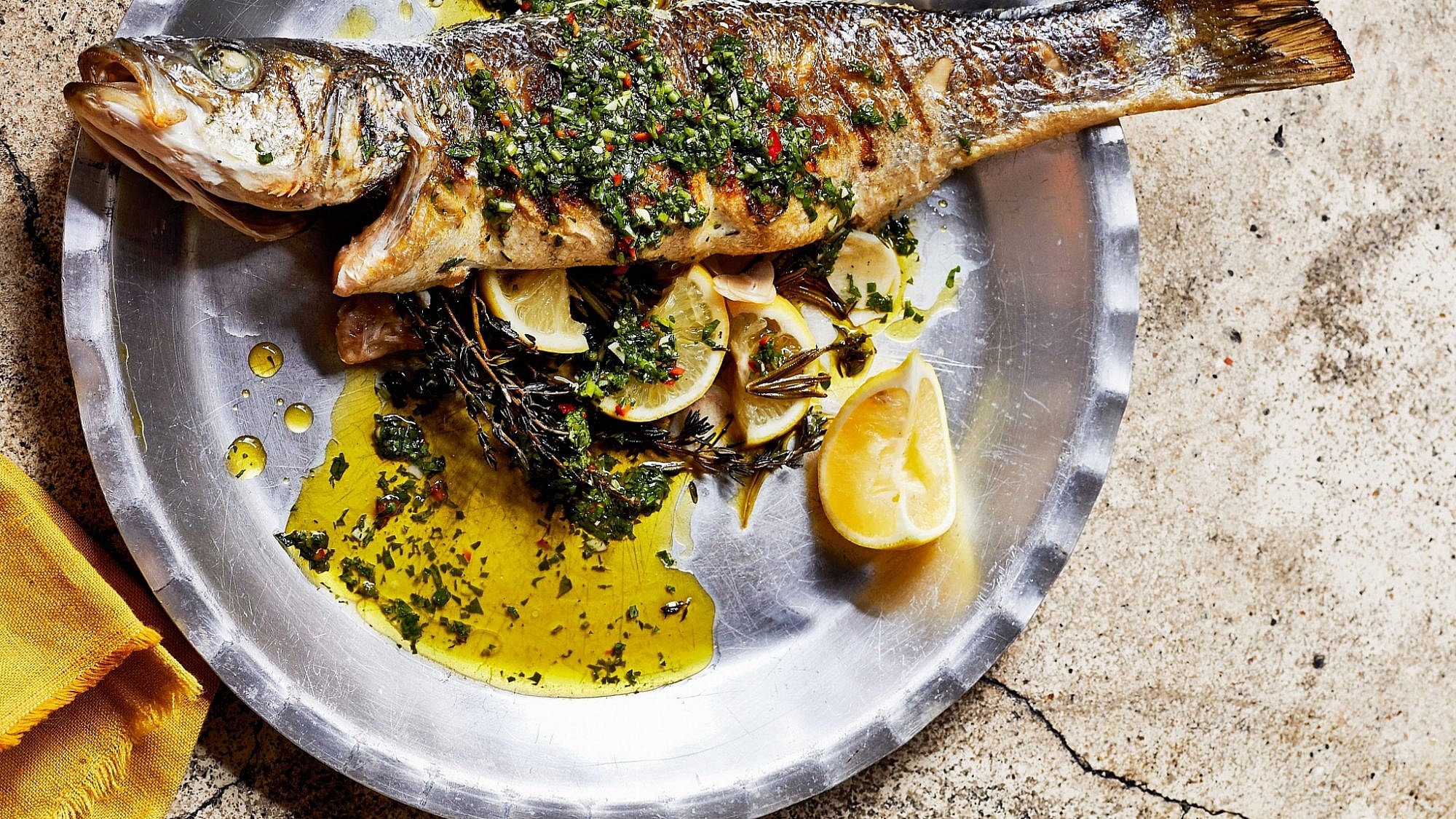 Whole grilled fish with chimichurri & za'atar